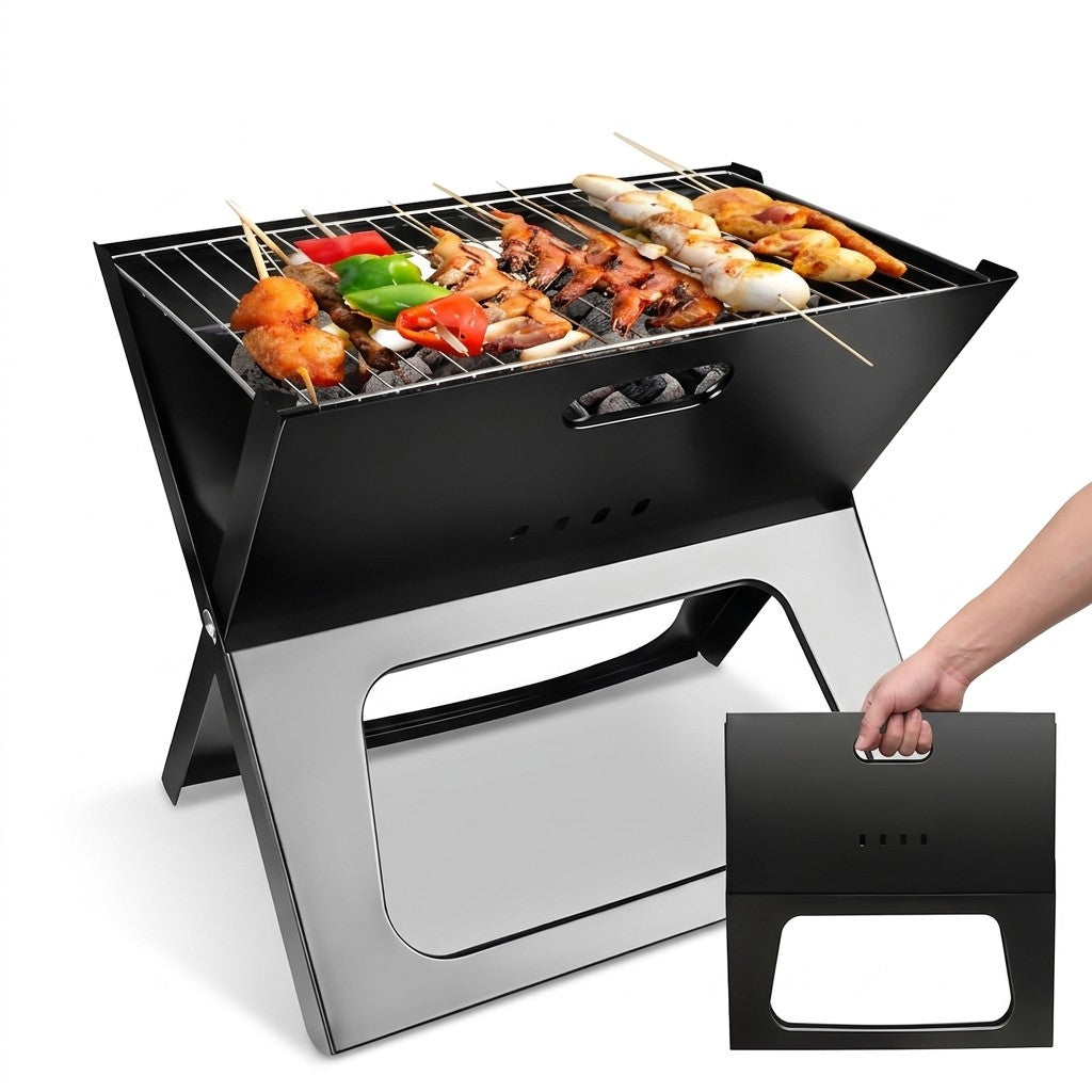 A compact black and silver folding portable grill shown open with skewers of food cooking on top, alongside a hand holding the product's folded carrying case against a white background.