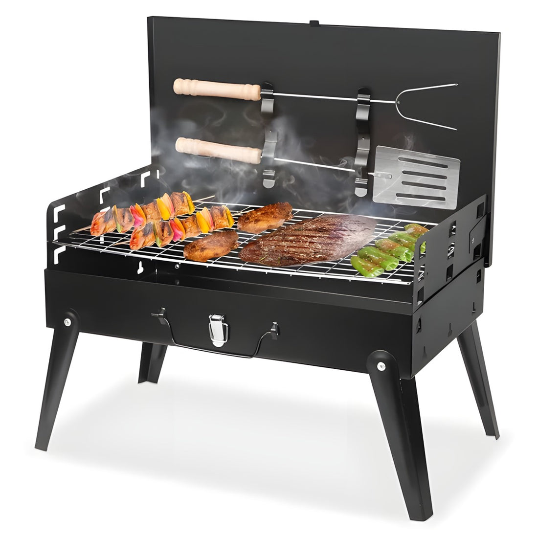 A black metal mini grill with legs, a wire grate, and a back panel holding two tools with light wood handles, shown on a white background.